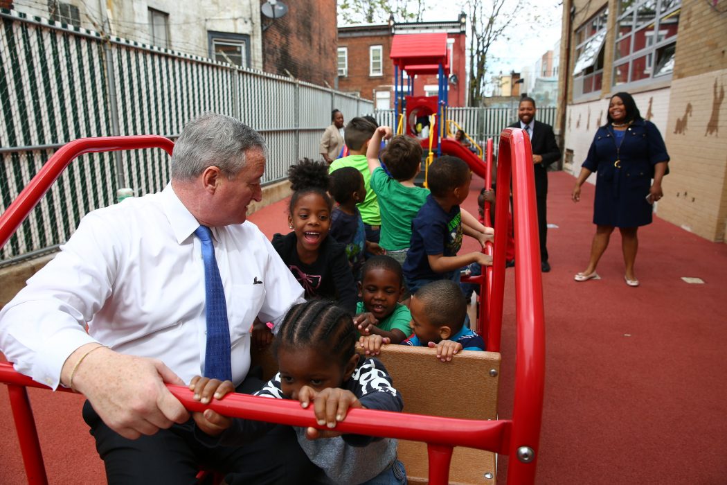 Mayor Jim Kenney spends time with children playing on playground