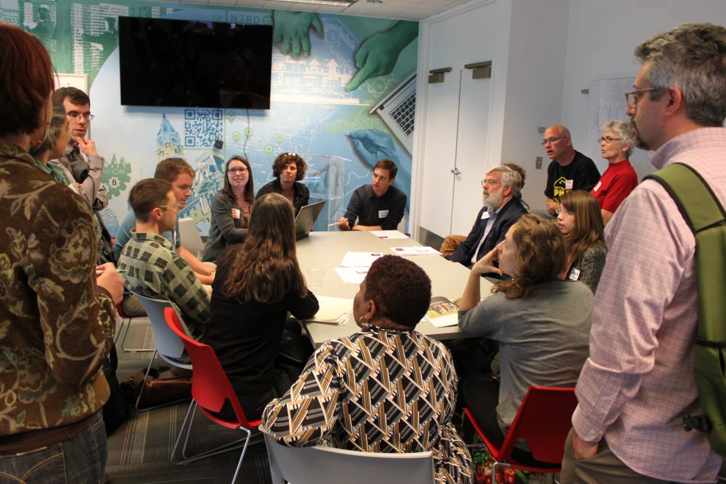 Participants in the Office of Sustainability's Powering Our Future visioning session gather around a table