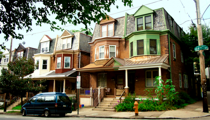 Row homes in a tree-lined street in West Philadelphia