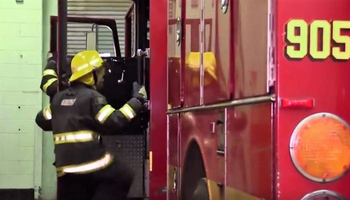 Students getting into fire truck.