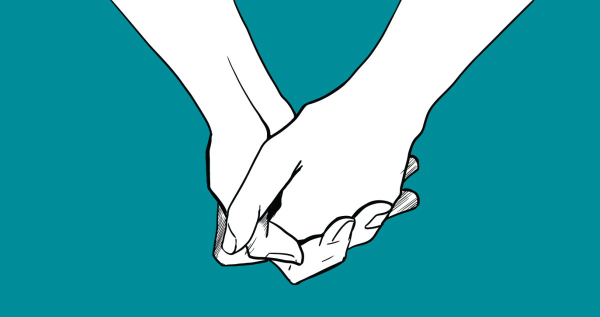 Hands clasping supportively