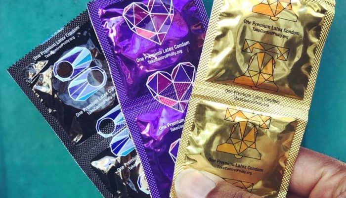 Latex condoms in foil wrappers.