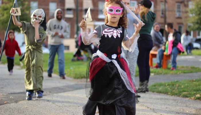 A girl dressed up for a Halloween parade