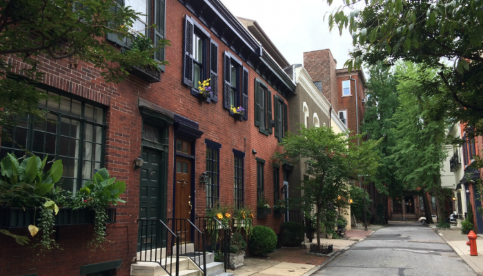 Brick row homes on a quiet street in South West Center City, Philadelphia