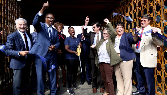 City officials cut the ribbon at the opening of the Discovery Center