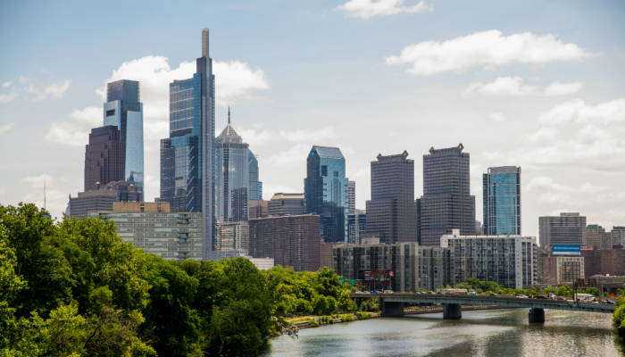 A view of the Philadelphia skyline with the Schuylkill river in the foreground