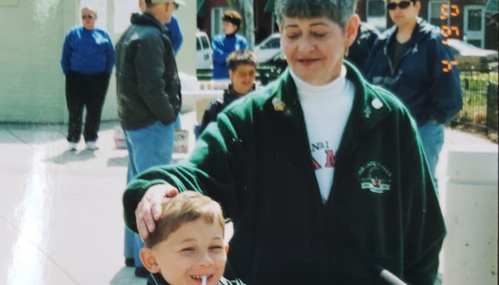 Dolores Bowers with a little boy in Campbell Square