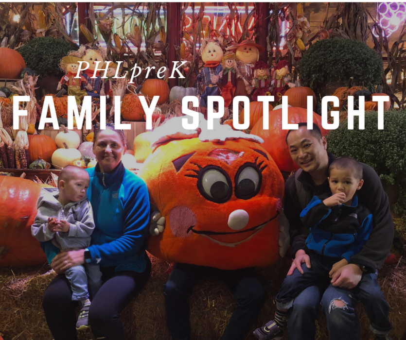 PHLprK student Jackson sits with his family at a pumpkin patch and smiles