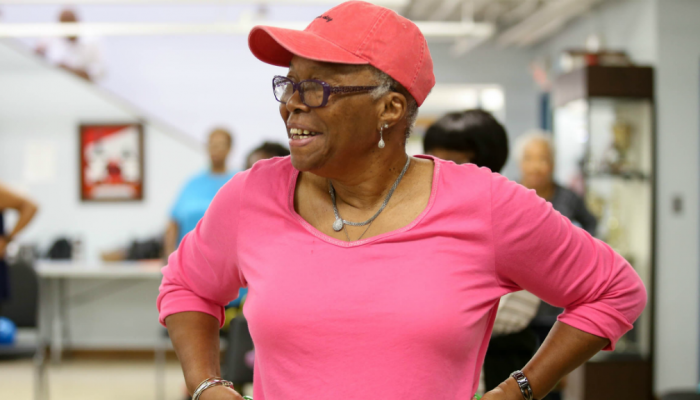 A senior citizen takes part in aerobics class
