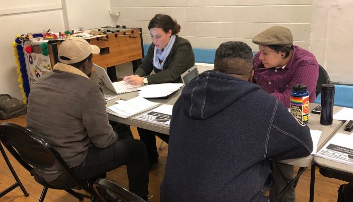 people sit with expungement lawyers