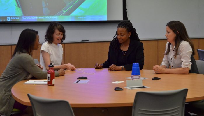 Four women sitting at a table