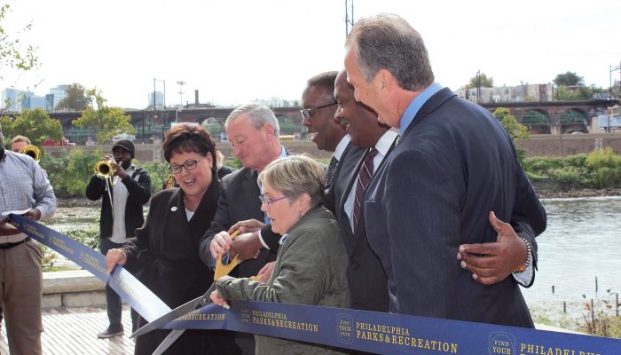 Officials cut the ribbon to open the Water Works Trail