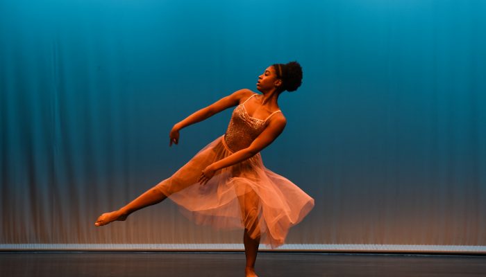 A female dances in a performance