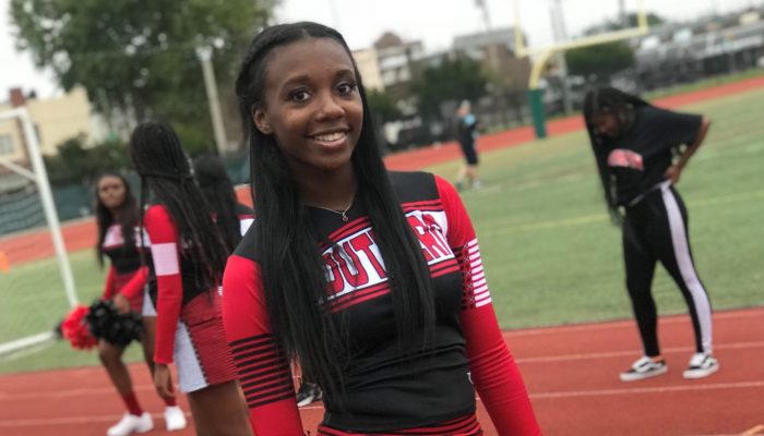 Tatiana Palmer, a senior at South Philadelphia High School smiles in her cheerleading outfit