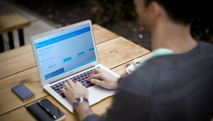 A man views Philadelphia's Real Estate Tax balance web page from a laptop computer