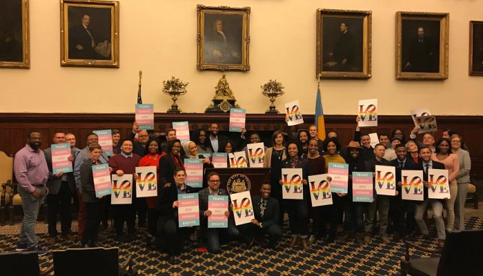 participants of the lgbtq leadership pipeline pose together with rainbow love signs