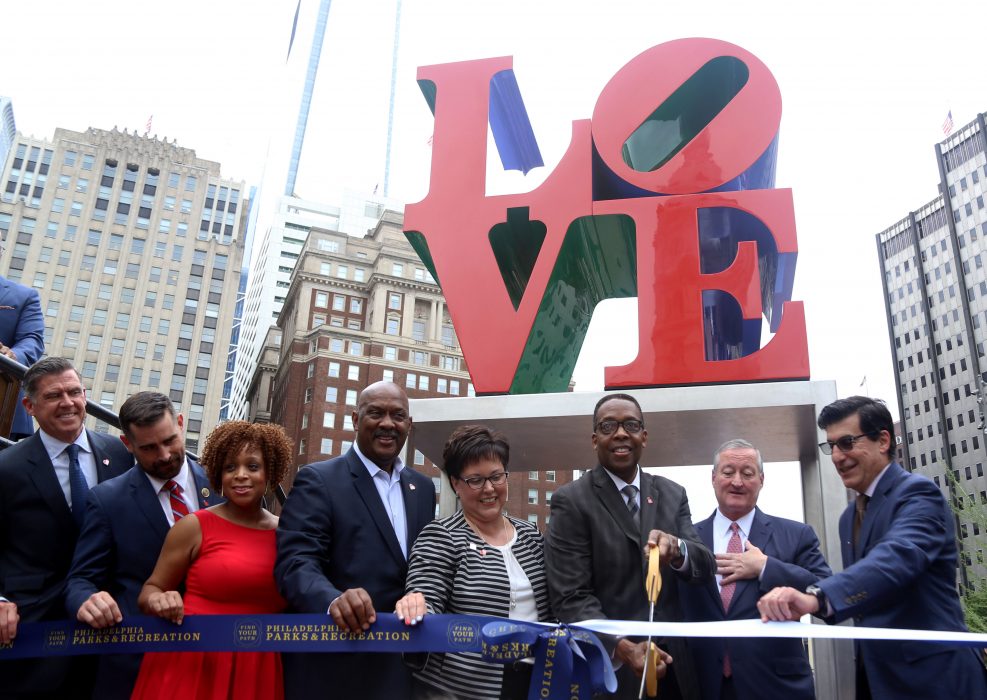 City officials and other dignitaries cut the ribbon during the grand re-opening to the newly redesigned LOVE Park on May 30. 