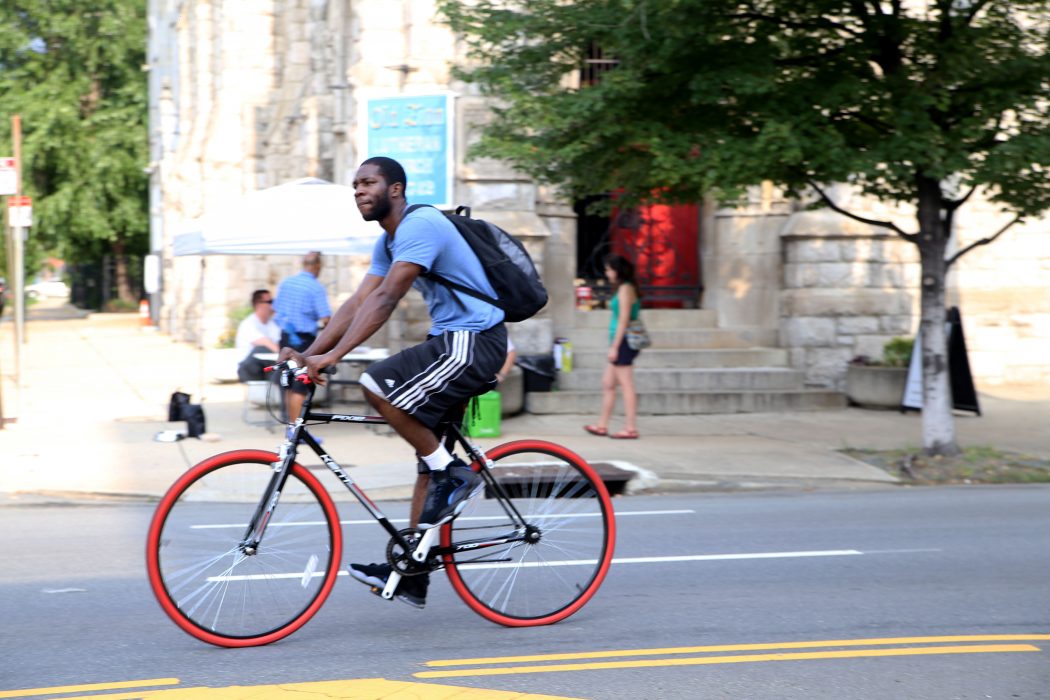 A man rides his bike along North Broad Street during the third annual Philly Free Streets on August 11.