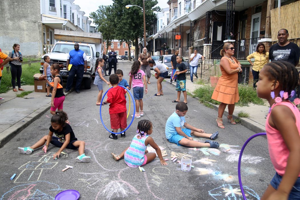 Kids participate in the Playstreet program in the Kensington neighborhood on August 22. Playstreets is a Philadelphia Parks and Recreation program that provides resources, like free nutritious meals and sports equipment, for blocks to temporarily shut down during the day and become safe places for kids to play during the summertime.
