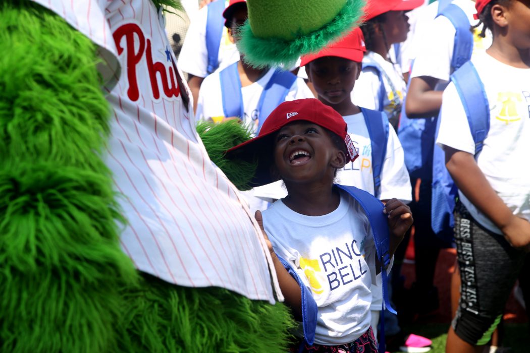 A girl laughs at the Phillie Phanatic during the Ring the Bell PHL press conference at Citizens Bank Park on August 15.