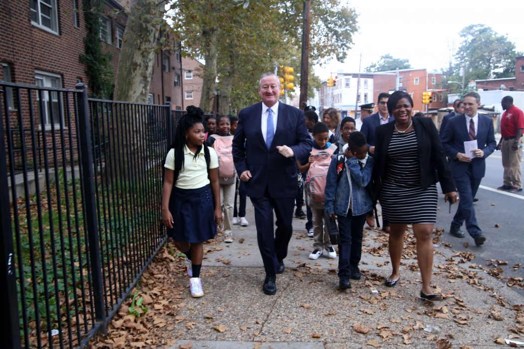 Mayor Kenney and students from Gideon Elementary School, a community school, walk to school for Walk to School Day on October 10.