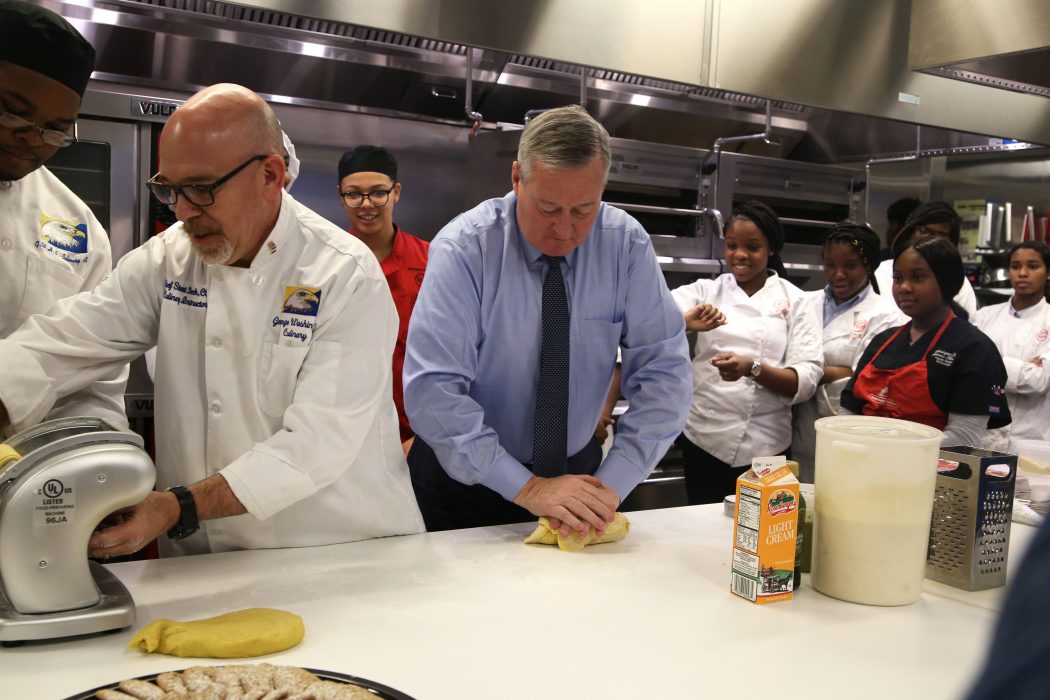 Mayor Kenney participates in a Sister Cities cooking class with community school students who traveled to Florence, Italy, on November 7.