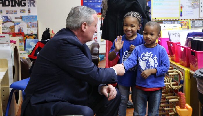 Mayor Jim Kenney shakes hands with PHLpreK studnets at Your Child's World