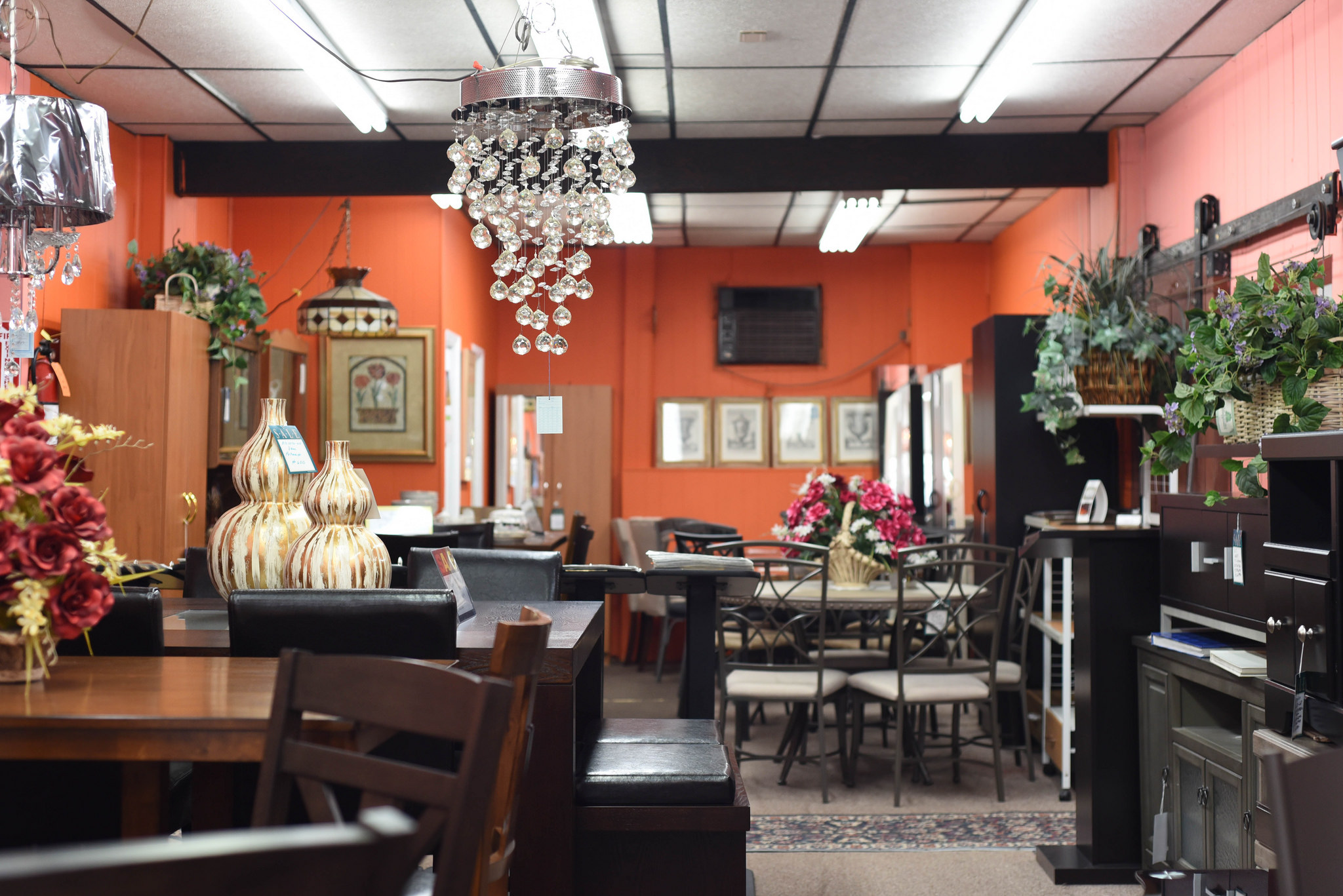 Tables, lamps, and other furniture inside Modern Age Furniture, a home decor shop in North Philadelphia.