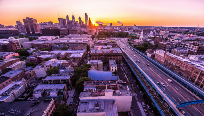 The sun rises over skyscrapers in Center City, Philadelphia