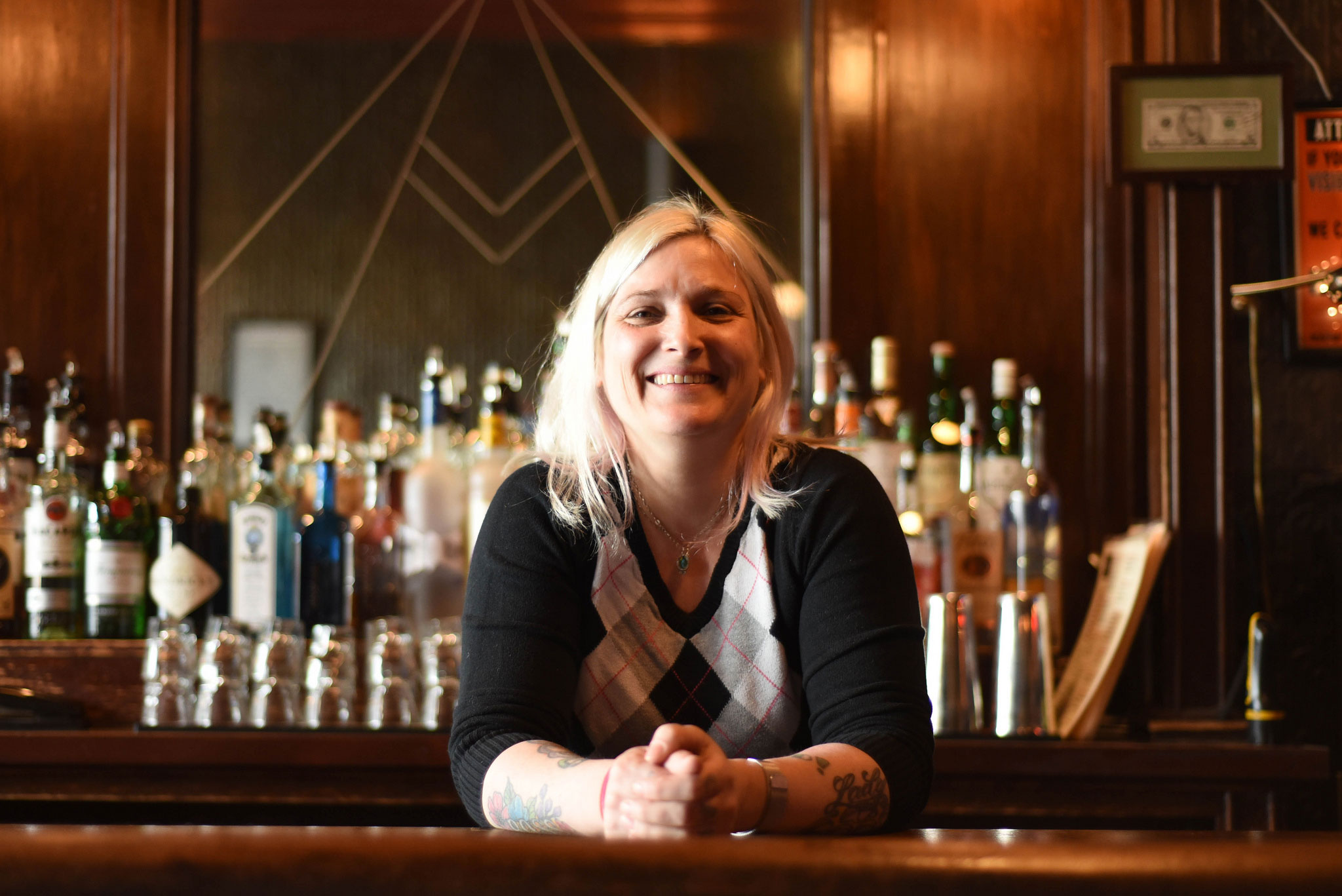 LuLu Maynard smiles behind the bar at Grace Tavern. 