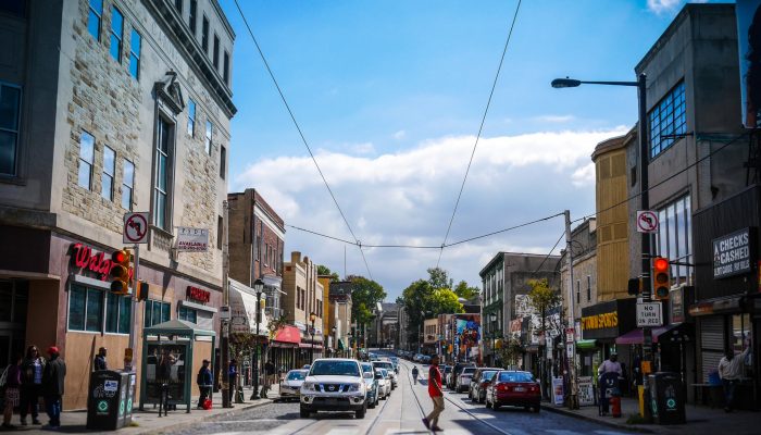 philadelphia street with colorful storefronts on a sunny day