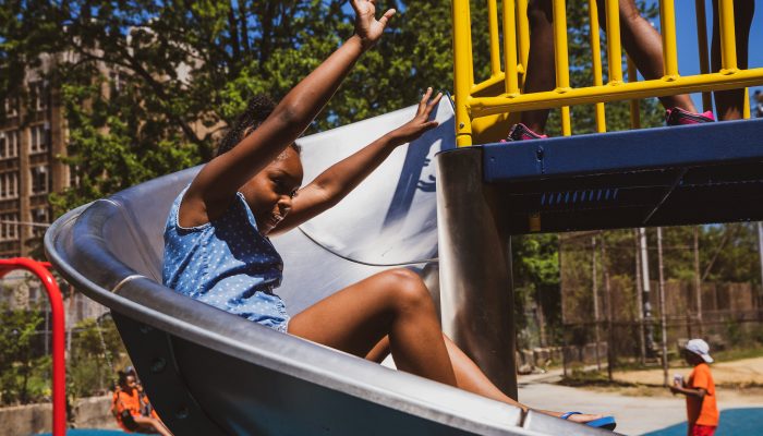 child playing on slide