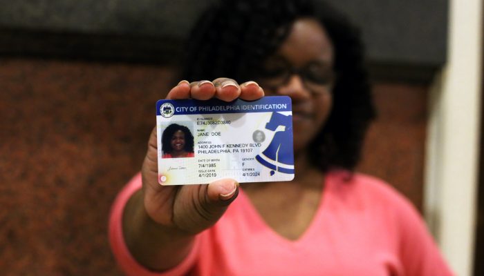 woman holding the PHL City ID