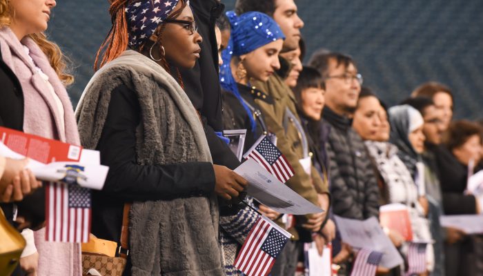 a group of people becoming naturalized U.S. citizens