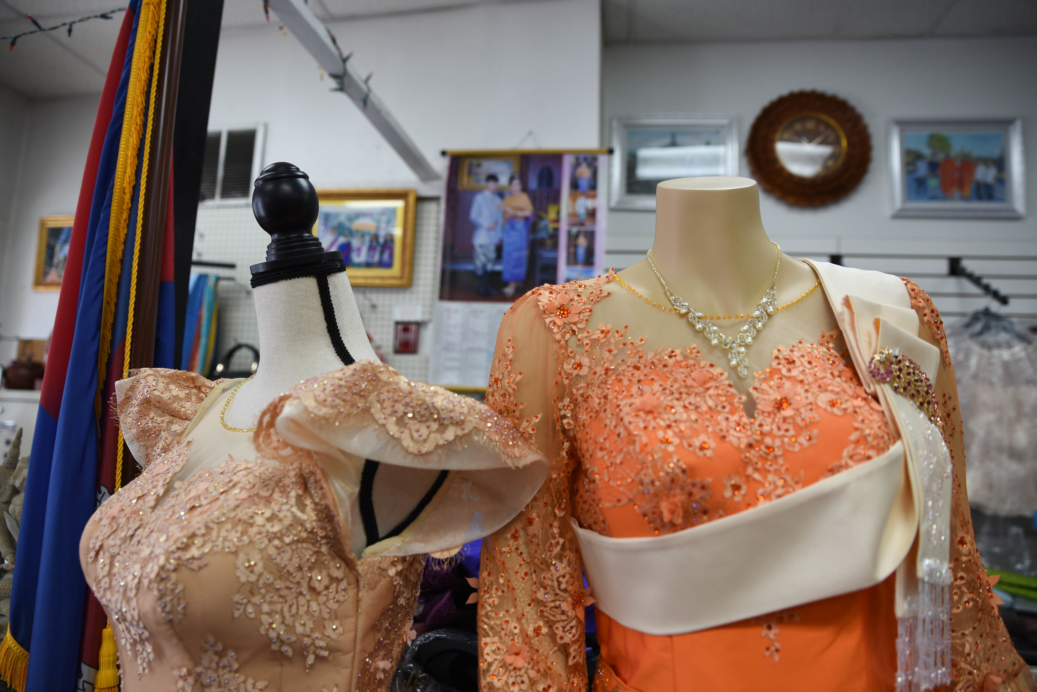 Two traditional Cambodian formal dresses displayed inside Seyla Banteay Srey shop on South 7th Street.