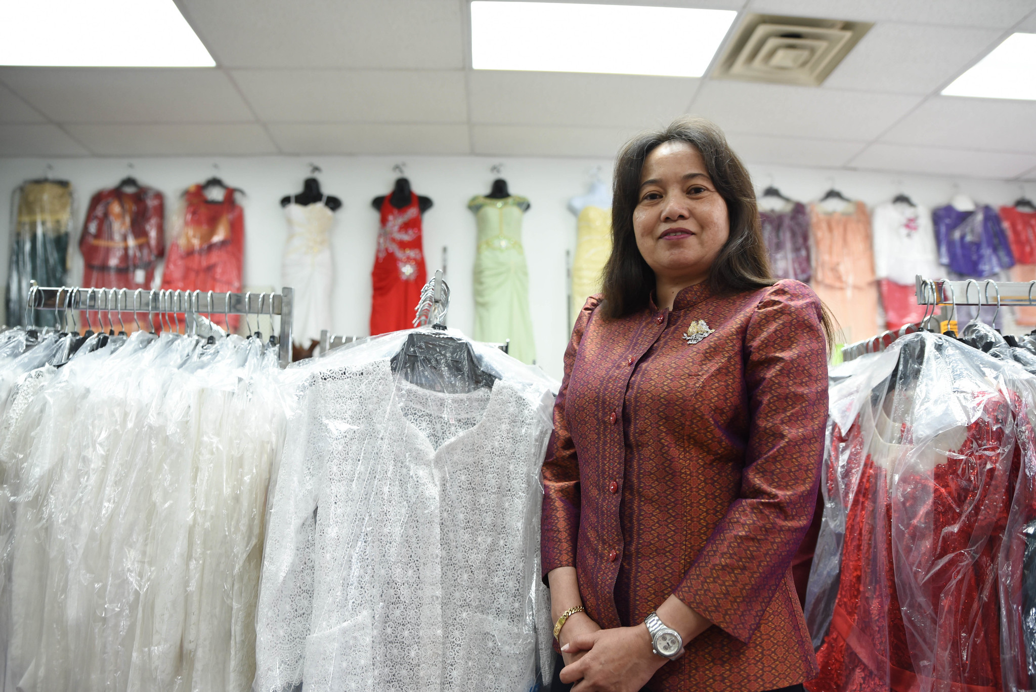 Phally Seng stands inside her clothing shop on South 7th Street.