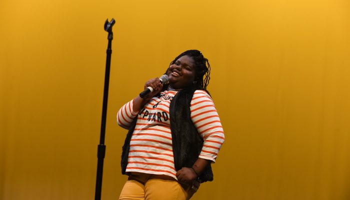 A girl holding a microphone at Venice Island Performing Arts & Recreation Center