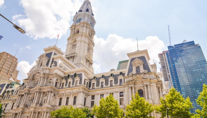 Philadelphia City Hall with trees in the foreground.