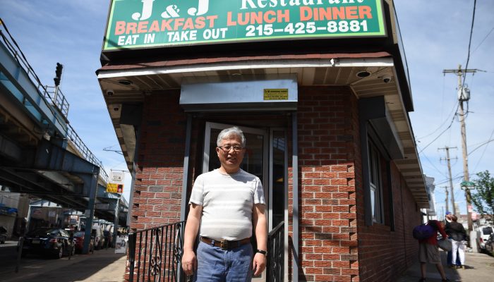 Owner Yong Chun stands in front of his breakfast and lunch establishment, J&J restaurant, on Kensington Avenue.