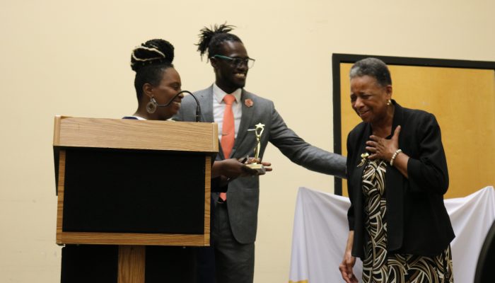 Reverend Phyllis Harris, receiving the Alain Locke School champion award with Pam Evans, Locke Community School Coordinator and Maxwell Akuamoah-Boateng, Director of Operation, Community Schools