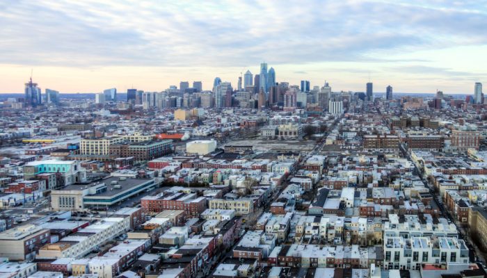 Aerial view of homes in South Philadelphia with the city skyline in the background.