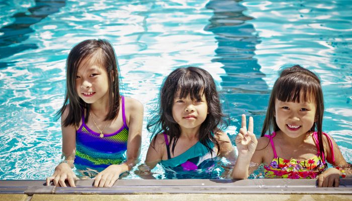 Three girls in the pool at Jardel Recreation Center