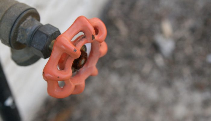 A water spigot outside someone's house