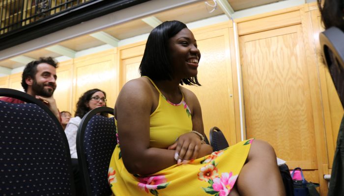 Lanayjah smiling as her name is read for a Community Schools Champion award