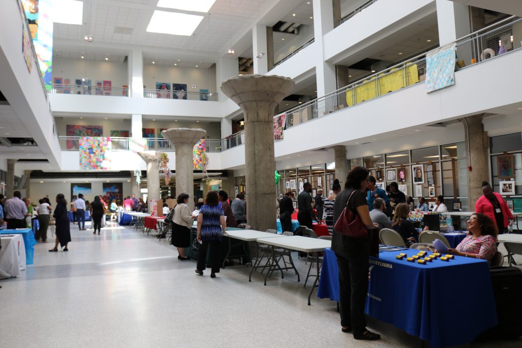 Attendees at a PHLpreK hosted job fair meet employers