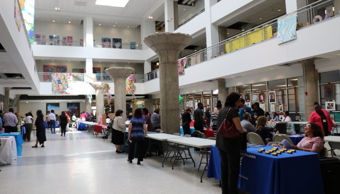 Attendees at a PHLpreK hosted job fair meet employers