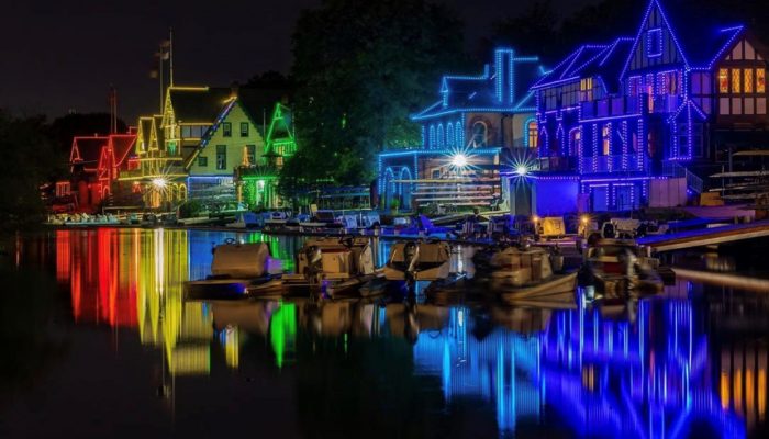 Boathouse Row lit up in rainbow colors. 
