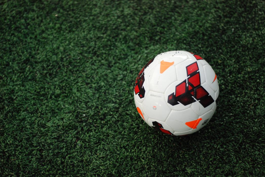 soccer ball on a green pitch