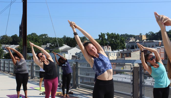 People doing yoga on Manayunk Bridge.