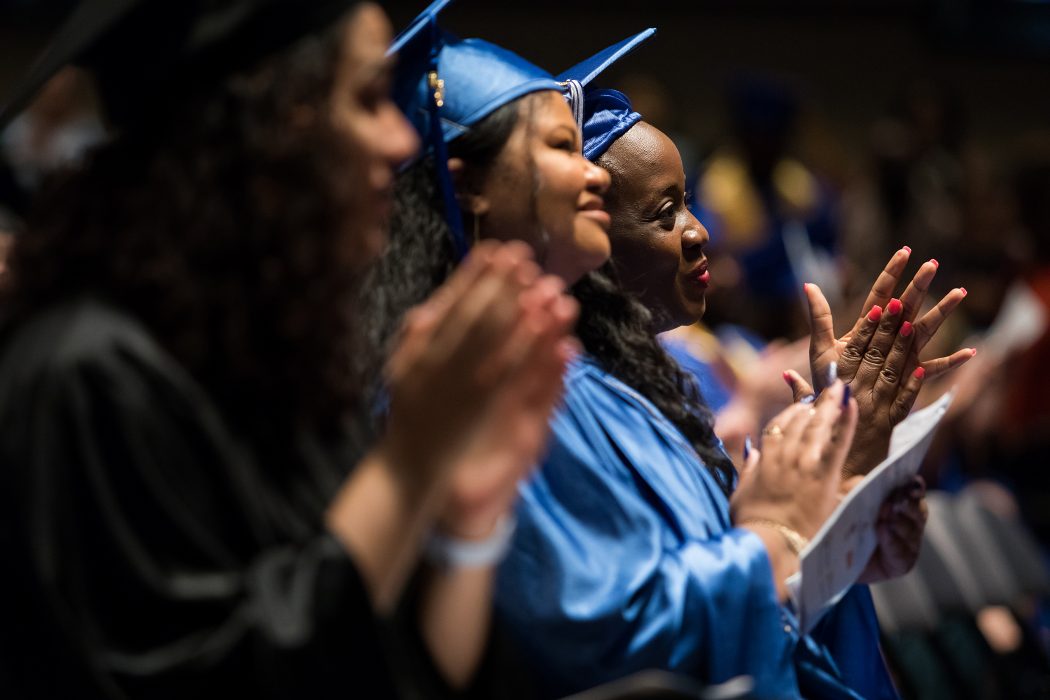 Graduates applaud at the Commonwealth Secondary School Diploma Citywide Graduation, held in June.
